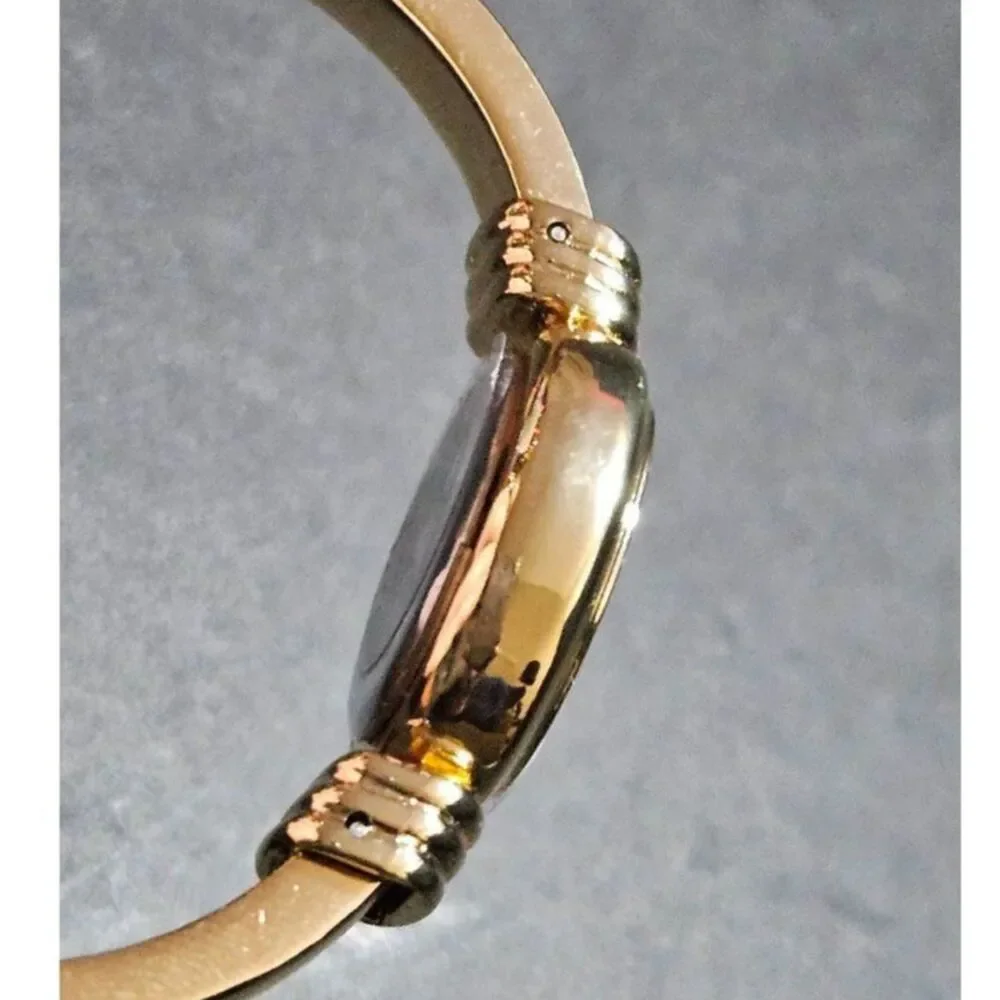Holiday Lane gold tone snowflake watch